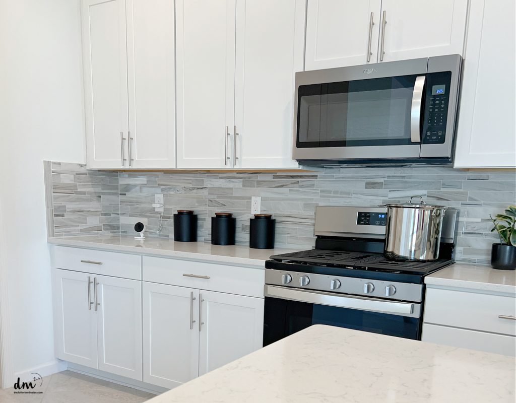 a microwave and oven in a kitchen