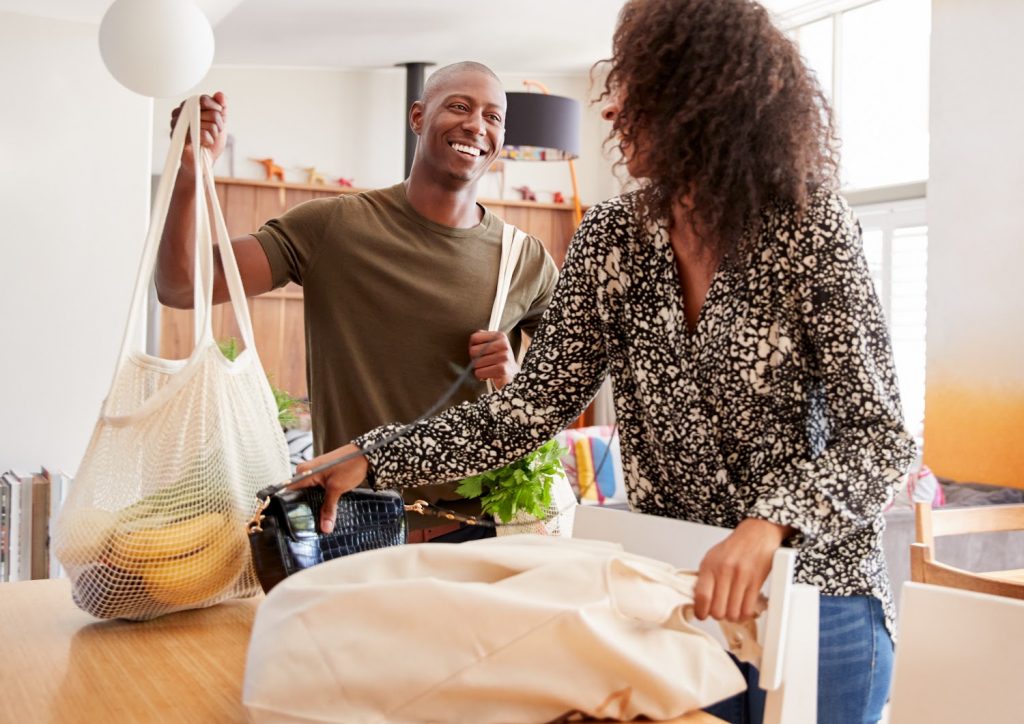 couple returning home from grocery shopping copy