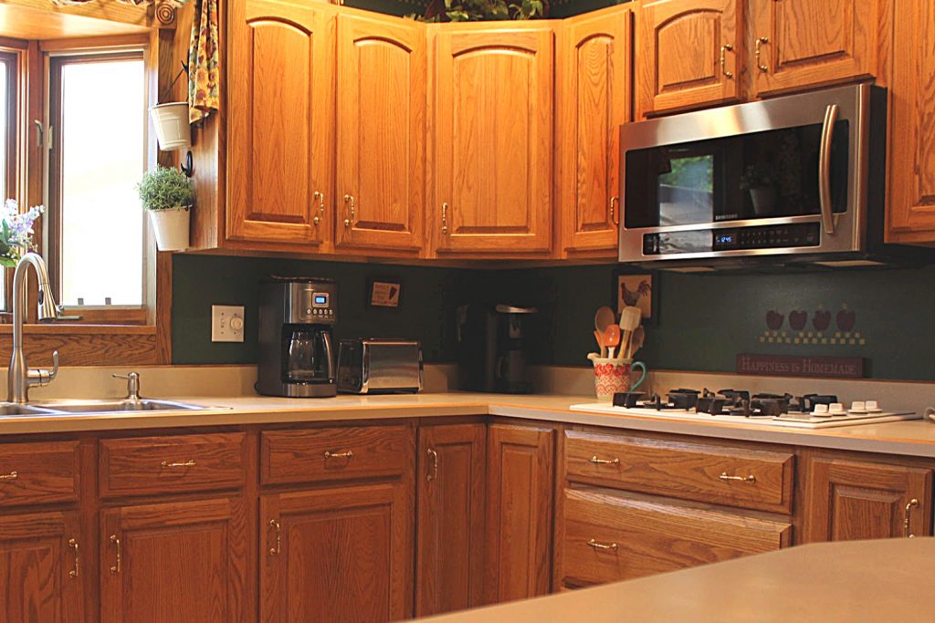 a kitchen with a microwave. Microwave cleaning hacks you can try today