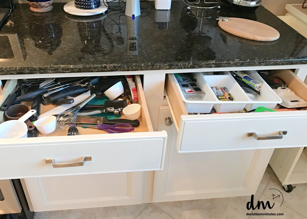 Two open kitchen drawers, one cluttered with utensils and measuring cups, the other organized with compartments for small items
