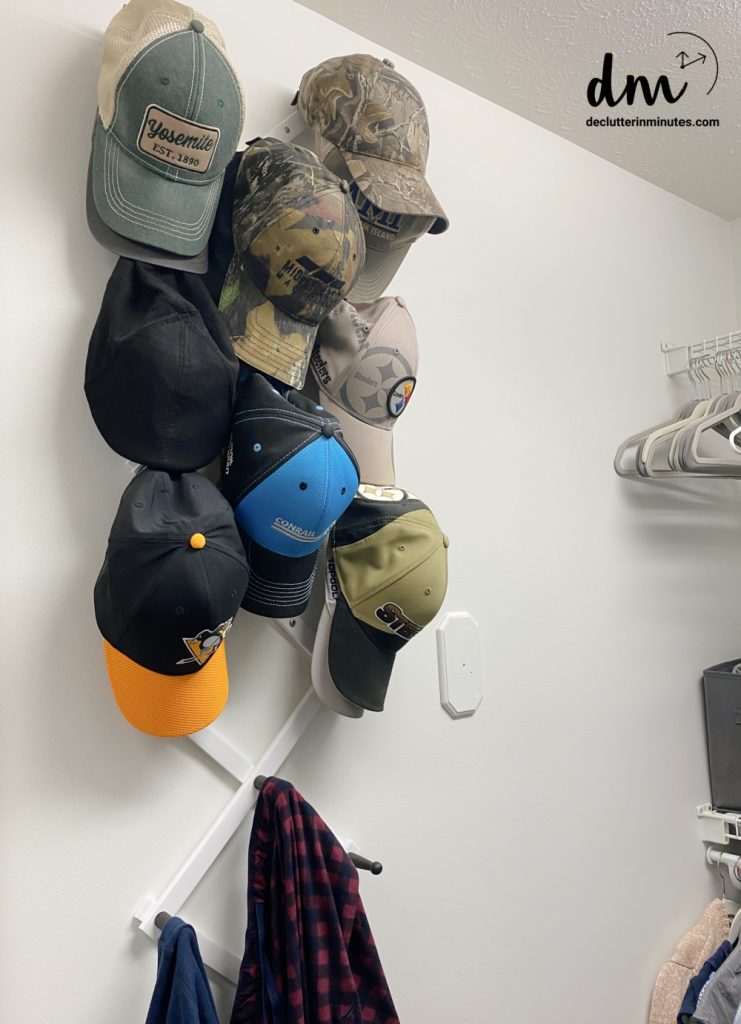 hats on an accordion wall organizer