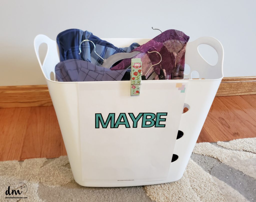 A white basket with a MAYBE sign on the front