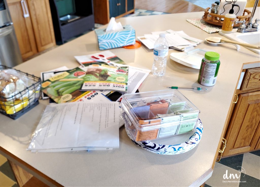 messy counter covered in clutter mail and stuff