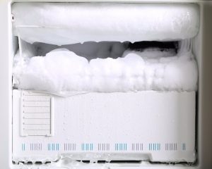 a freezer full of frost. How to clean out a freezer to help it last longer.