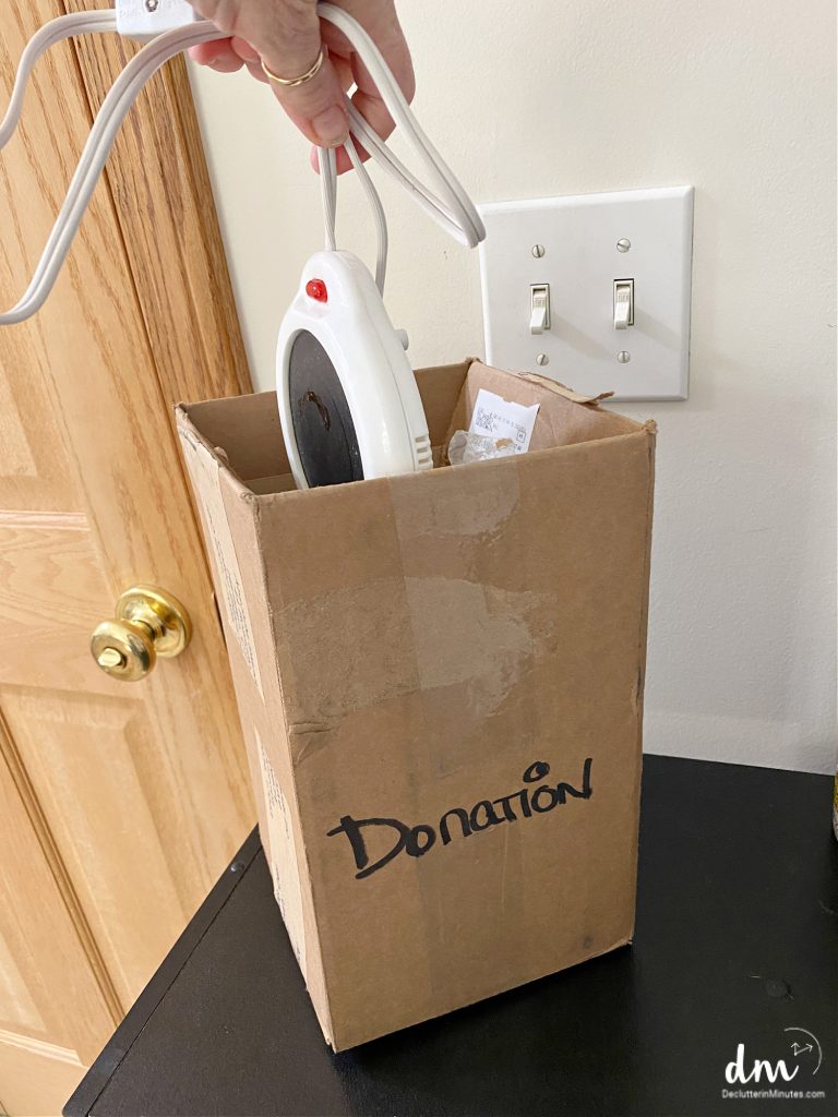 putting something into a donation box