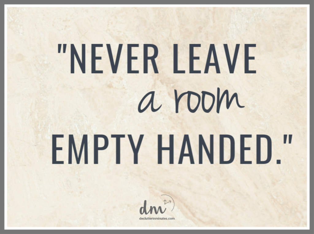 A decluttering quote on a textured background that reads, "Never leave a room empty-handed"