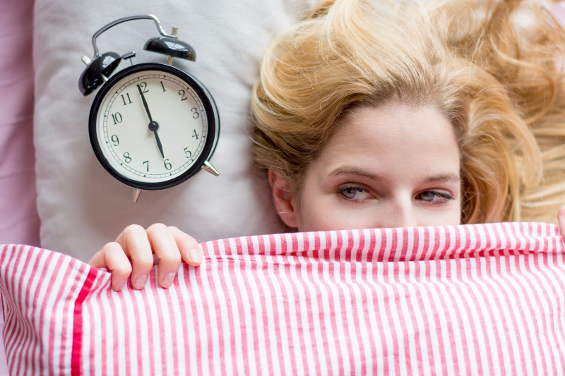 woman waking up happy with a morning routine