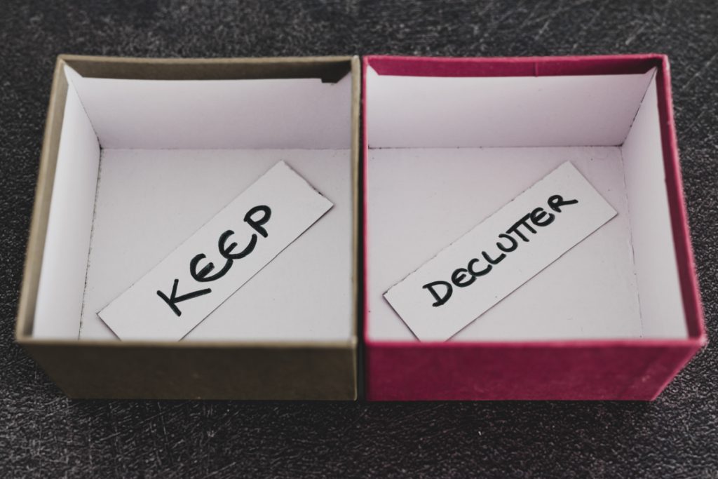two empty boxes, one labeled keep and one declutter