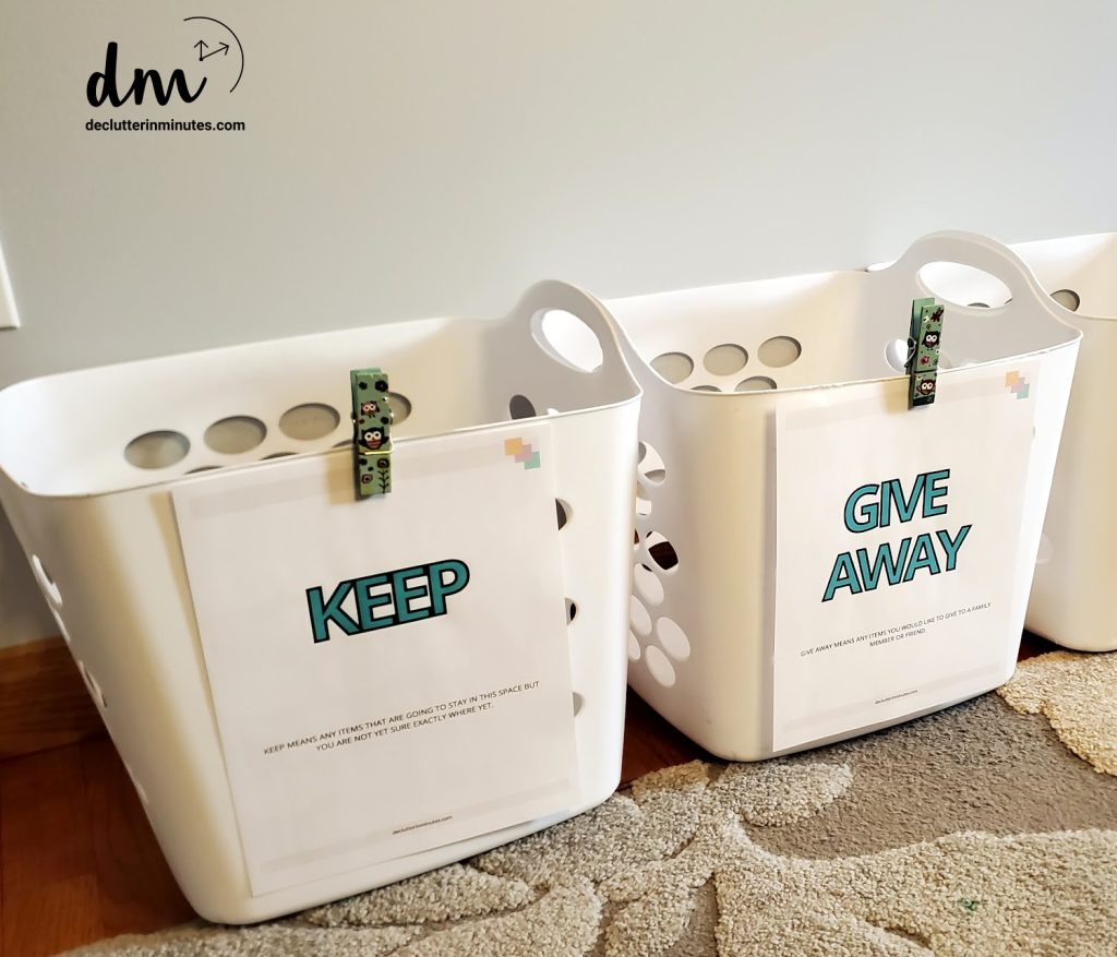 white baskets labeled keep, give away