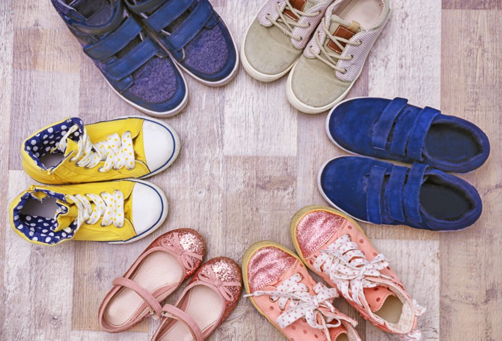 Colorful kids shoes on floor