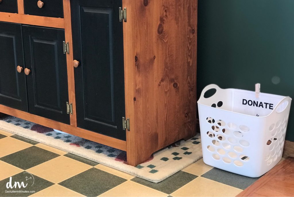 a donation basket in a kitchen to collect clutter