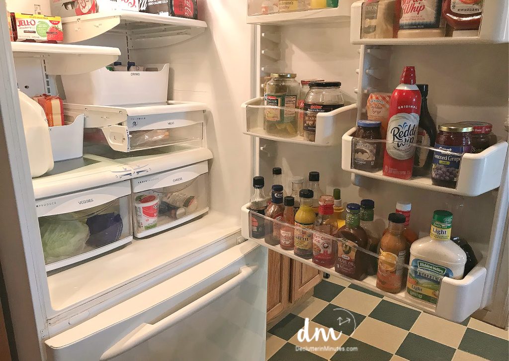 an opened refrigerator filled with food