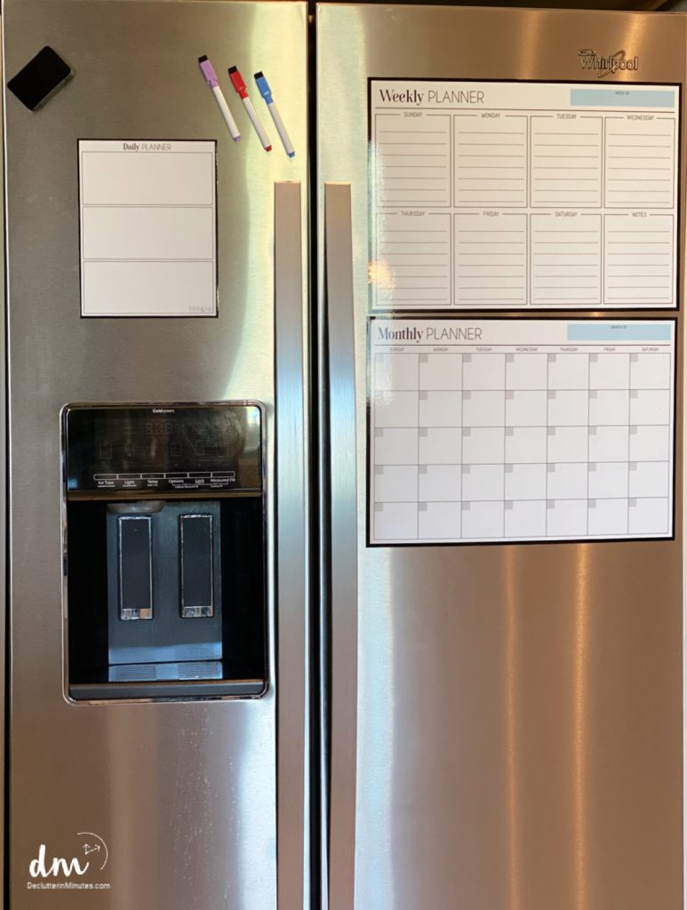 A fridge with a menu, to-do list and makers on the front