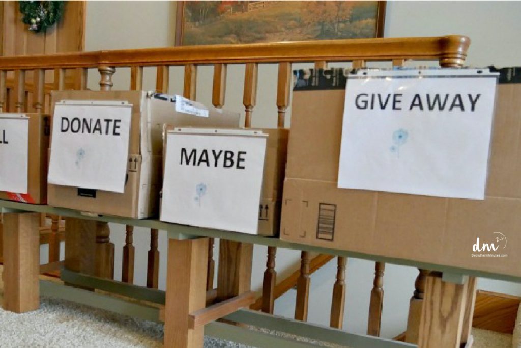 boxes labeled donate, maybe, give away 