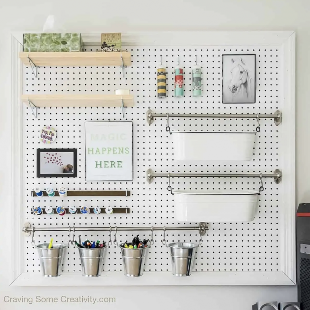 a pegboard of organizers for organization ideas for a sewing room 