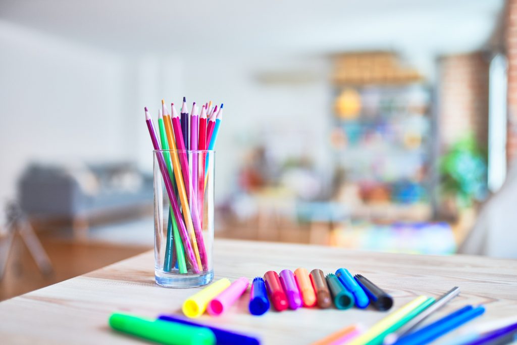 table of pens and markers in a craft room