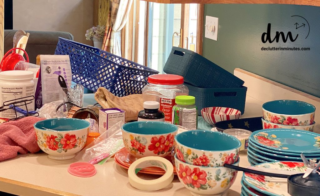 piles of random stuff on a kitchen counter