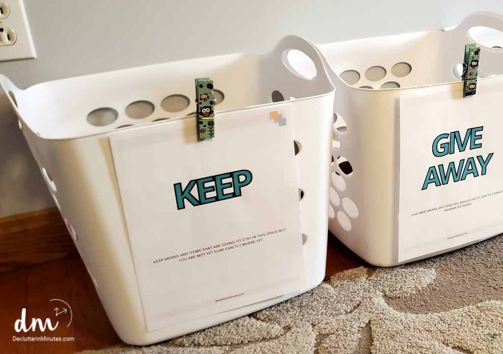white basket labeled keep and give away