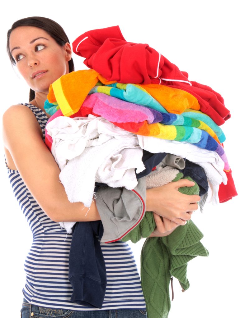 Young Woman with Pile of Washing. Model Released