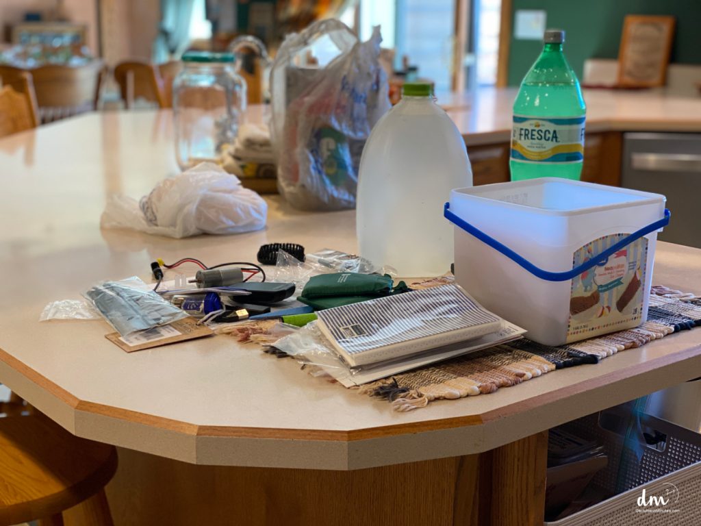 a messy cluttered counter in a kitchen