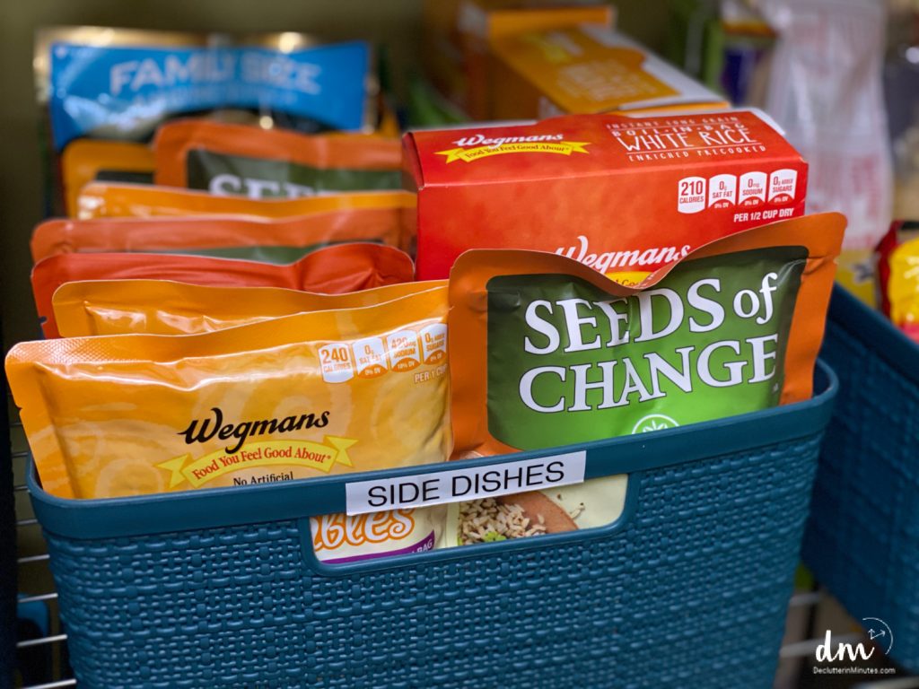 a basket labeled side dishes in a basement pantry