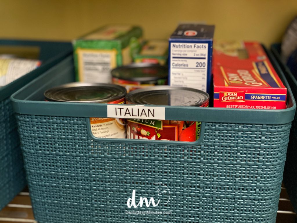 a blue bin labeled Italian full of pasta and sauce