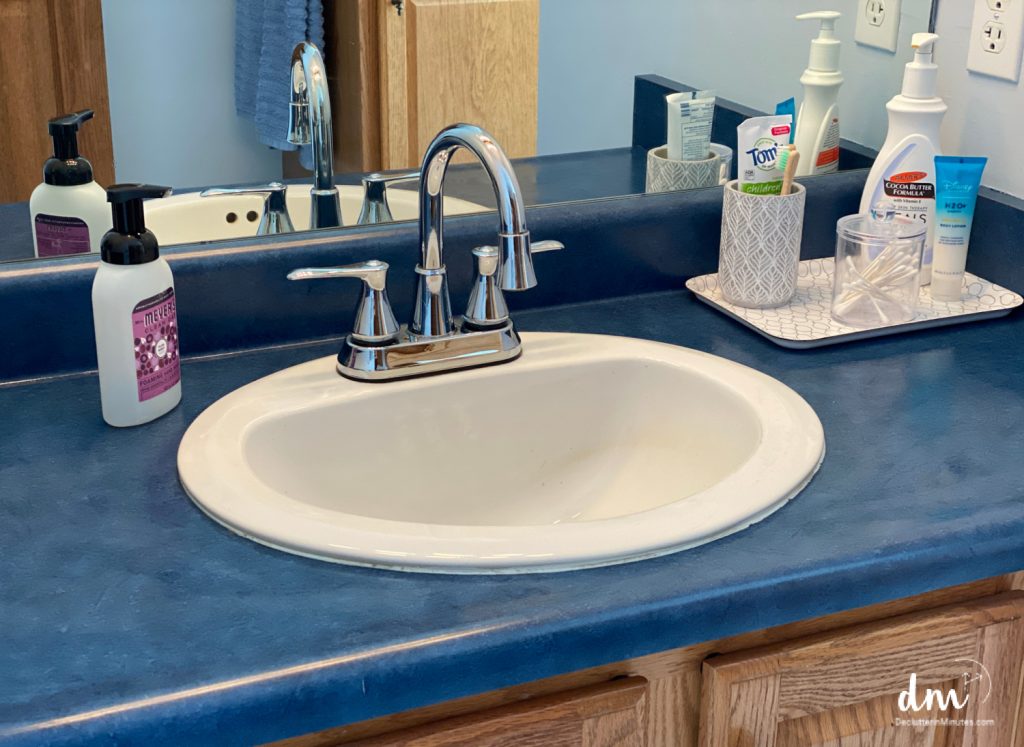a neat and organized bathroom sink area