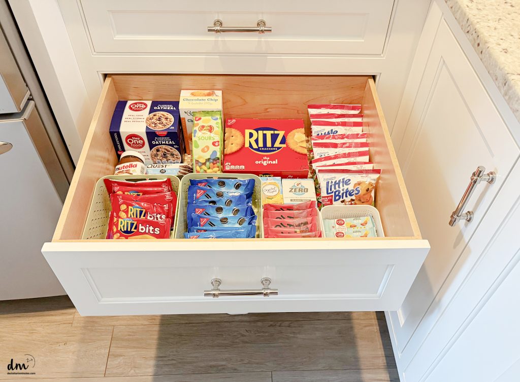 a snack drawer of food in a kitchen without a pantry