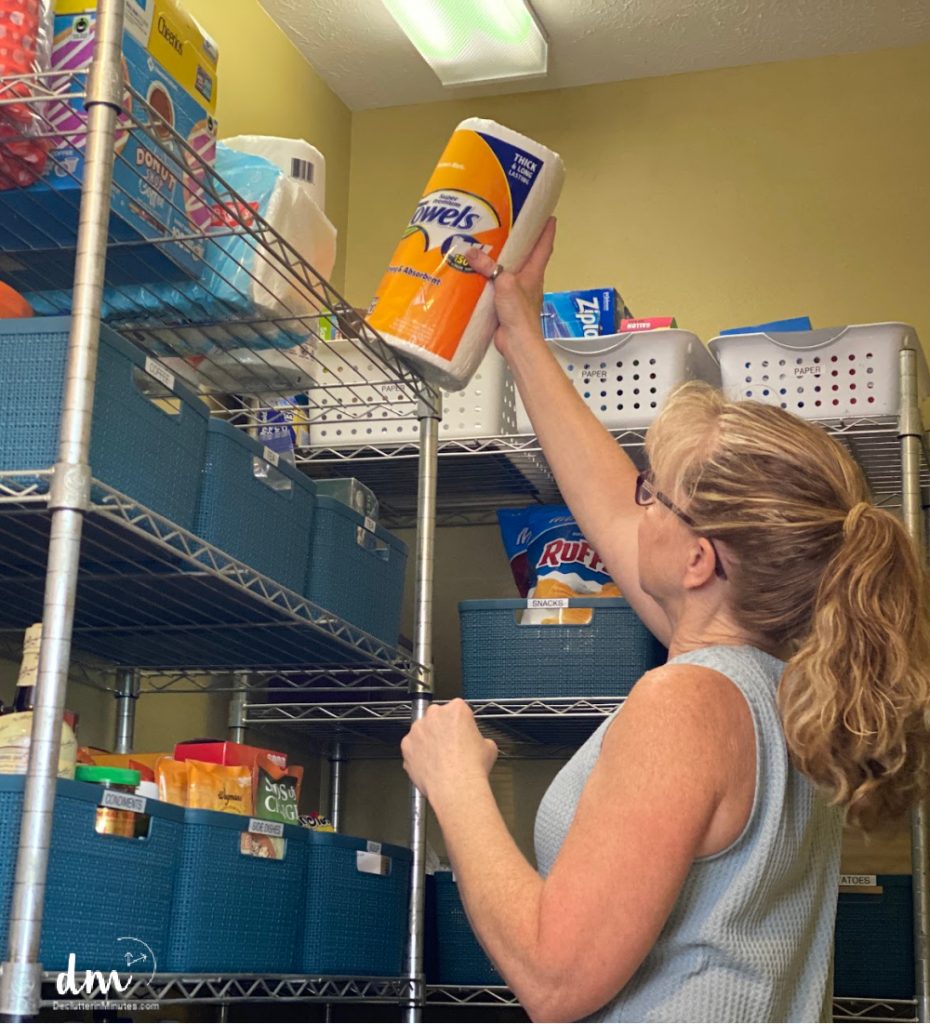 woman using a pantry paper towels