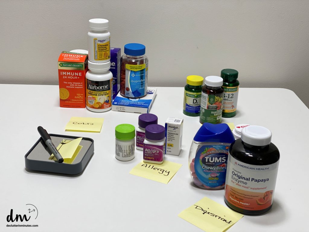 piles of meds with sticky notes describing each pile