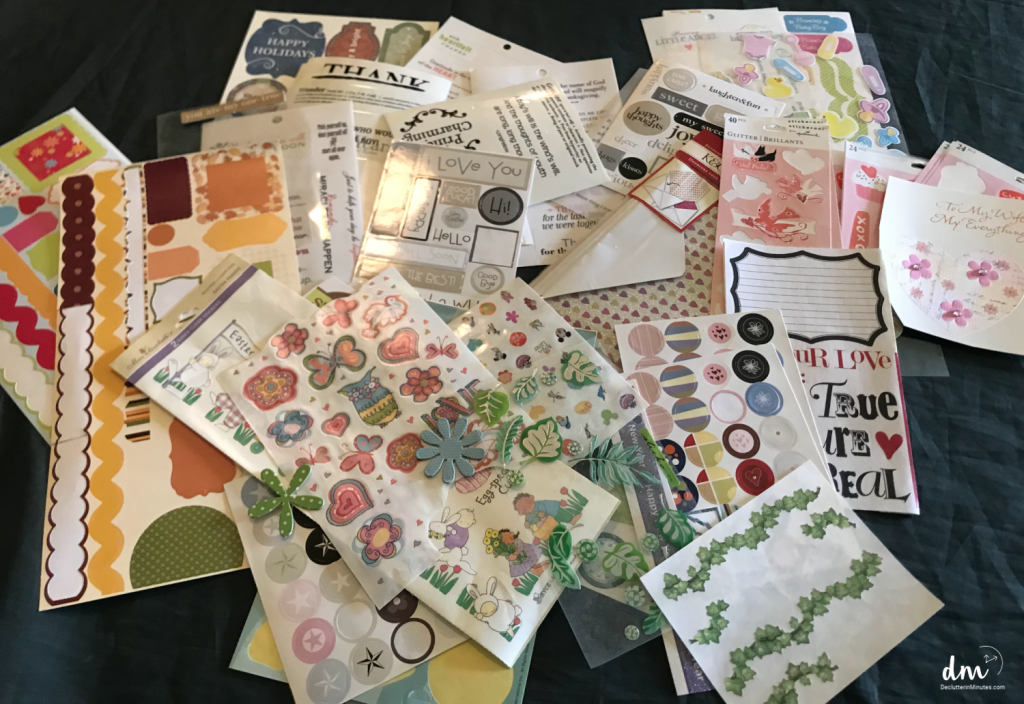 a pile of papers, cardstock, and stickers