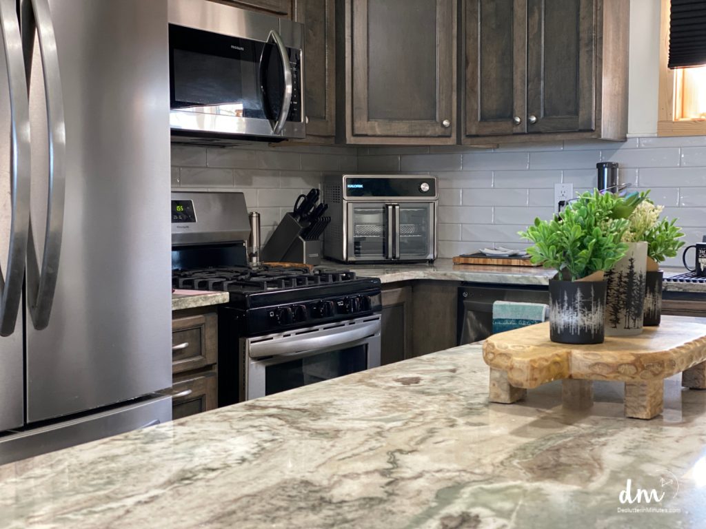 a view of a small organized small kitchen