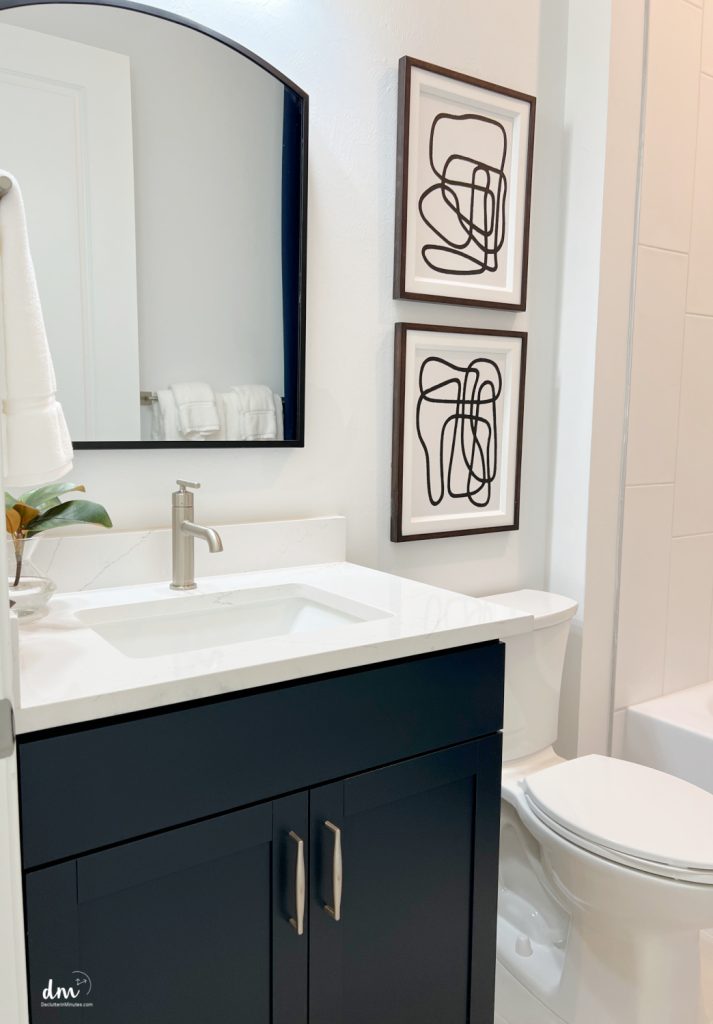 a white and black neat bathroom
