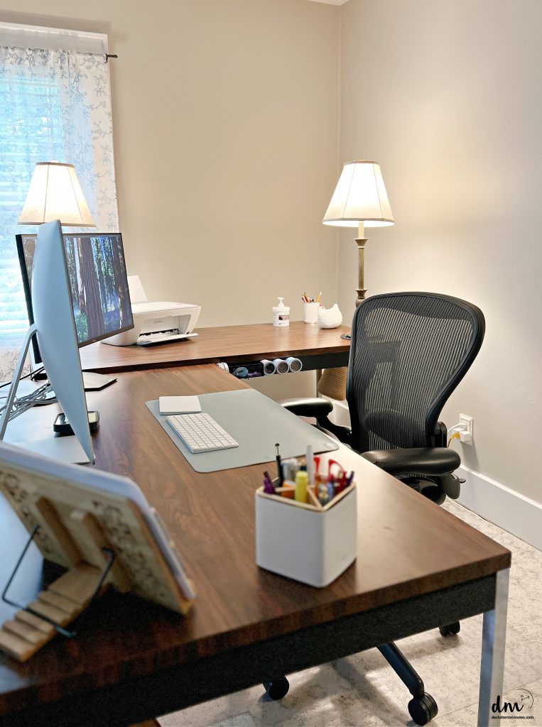 an L desk in a home office that is neat and organized