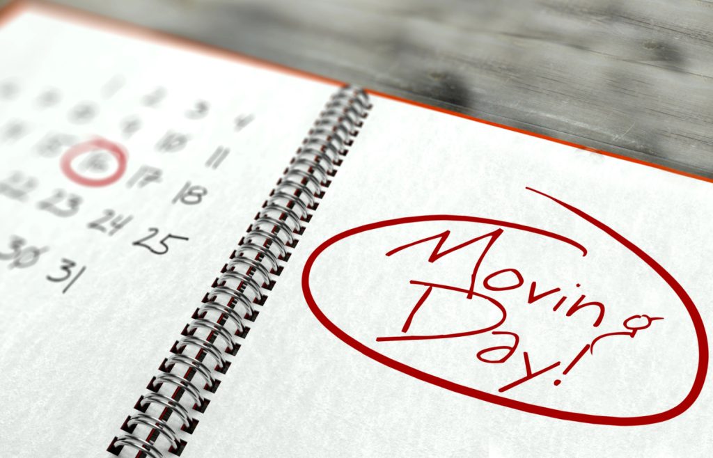 a calendar with MOVING DAY in red and circled