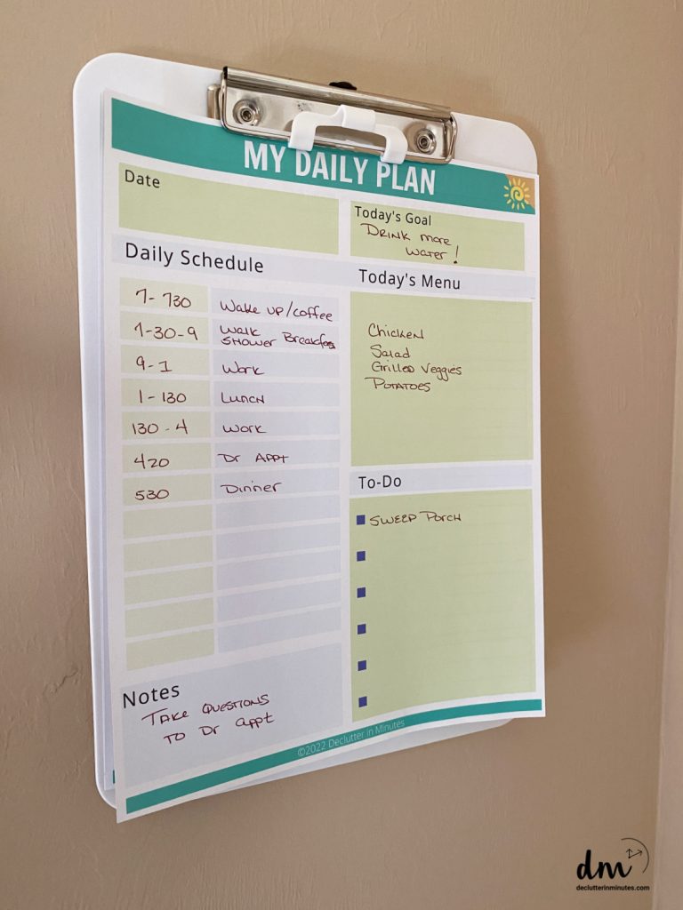 a daily planner page on a clipboard in a home hub