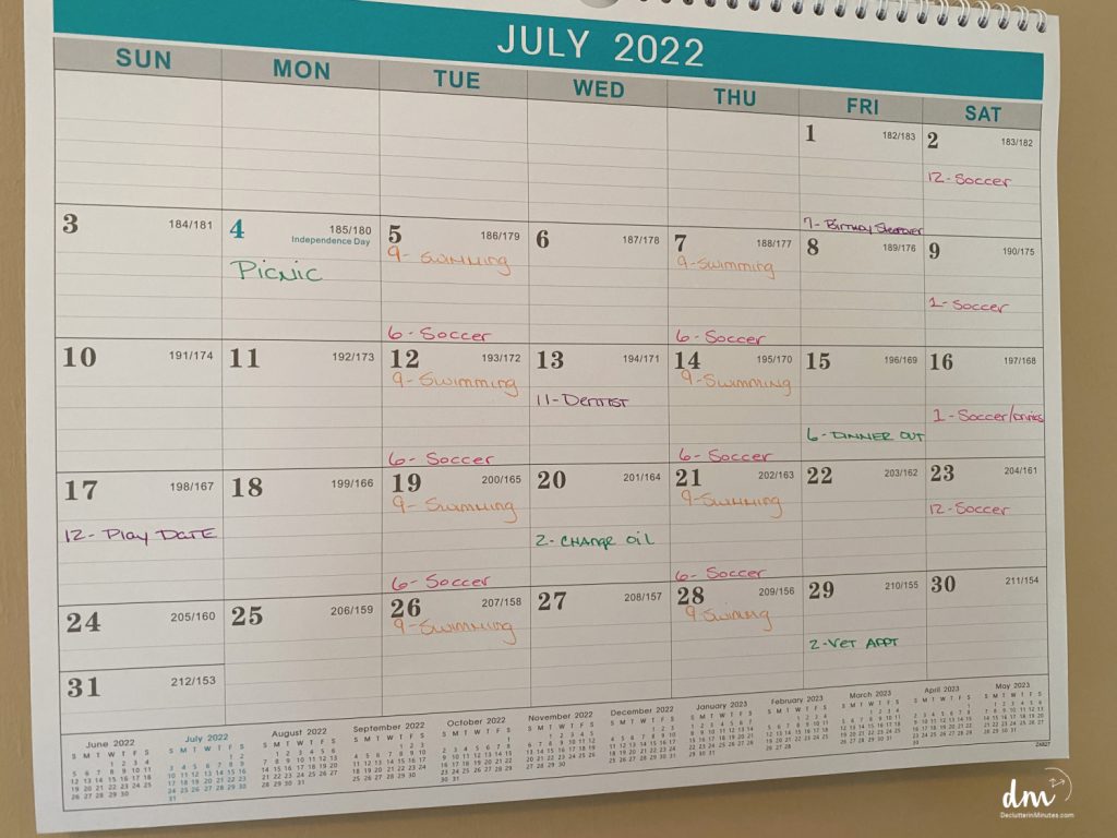 a family calendar with a different color for each persons schedule