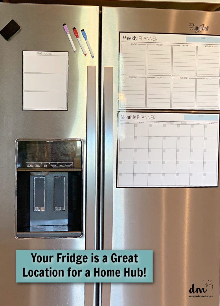 a fridge with calendars and planners on the front