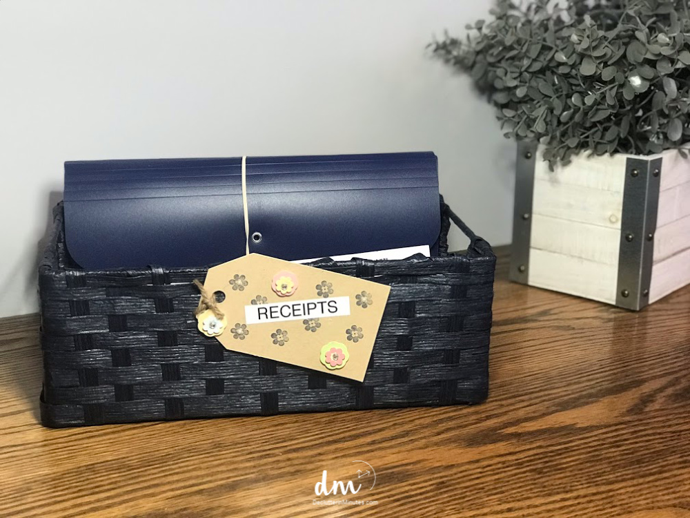 Image that shows an woven basket with a receipt organizer in it.