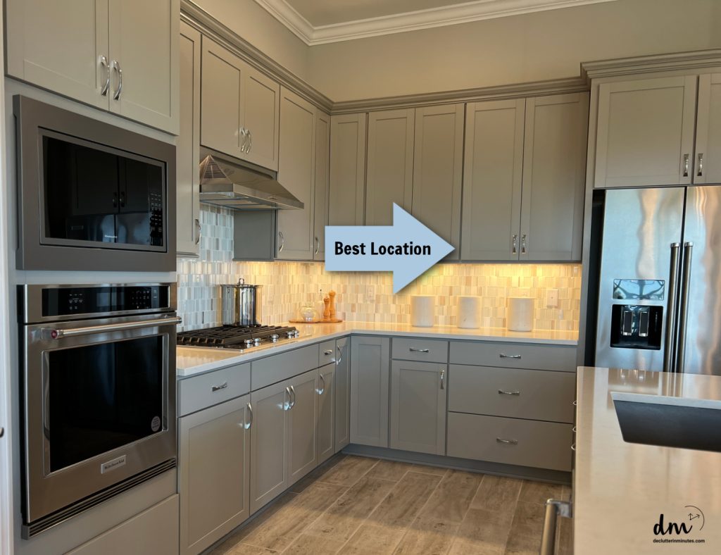 a kitchen with arrows showing the best location for a cabinet command center