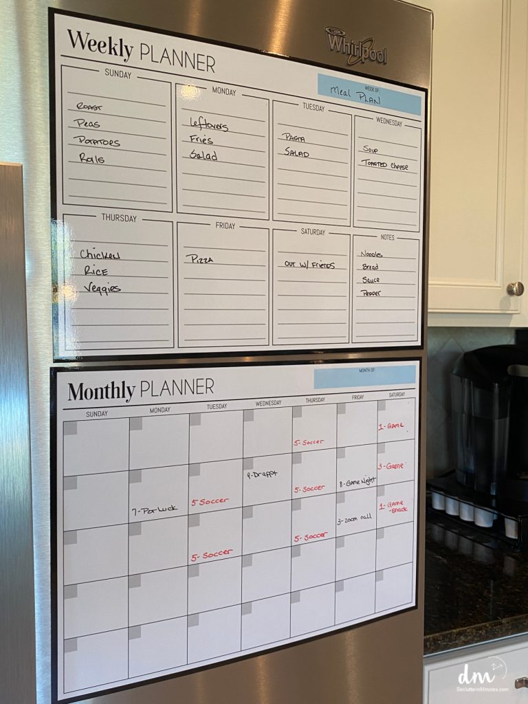 a menu and planner on the front of a fridge home hub