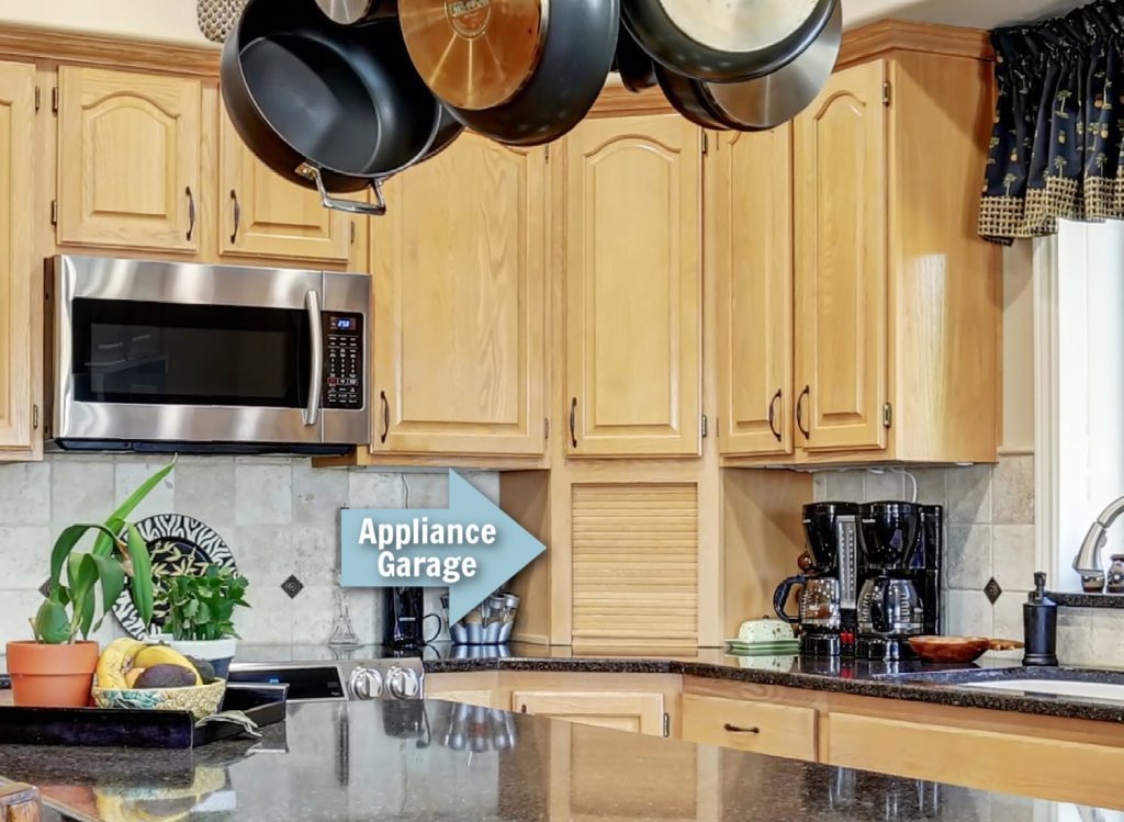 an arrow pointing to an appliance garage in a kitchen