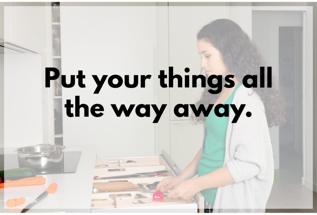 A quote: Put your things all the way away. on a white overlay of a woman in a green shirt cooking in a kitchen