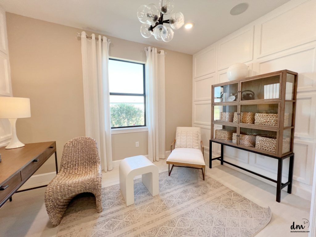 a neat home office with chairs a table and cabinet