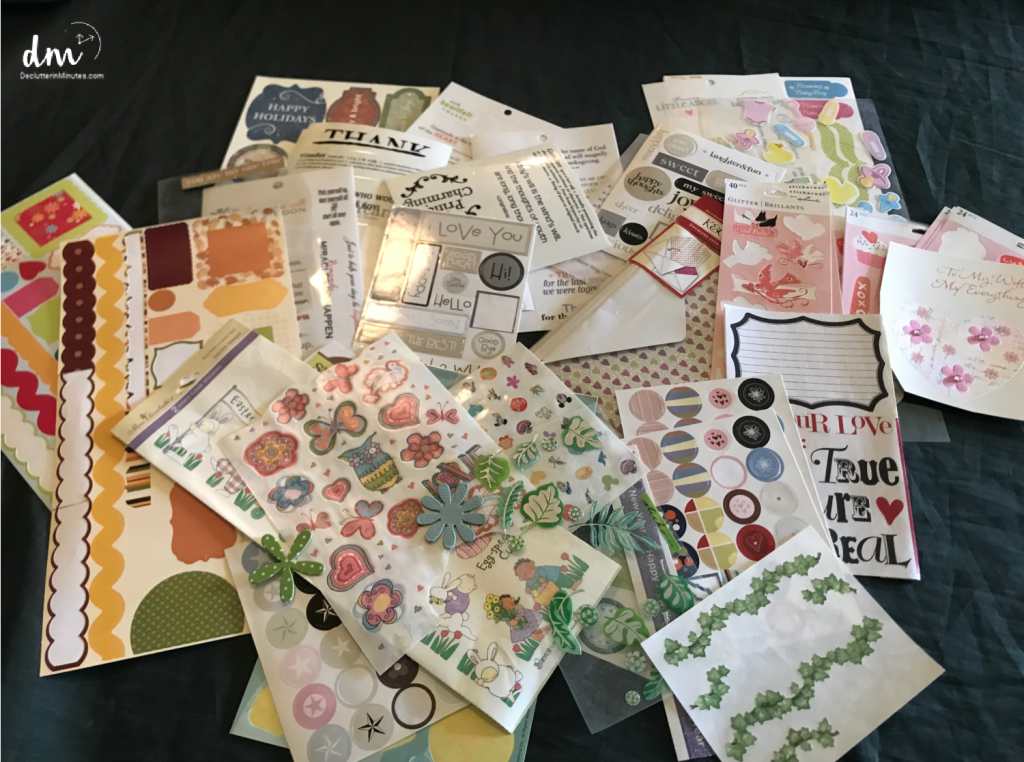 a stack of sticker sheets in a messy pile