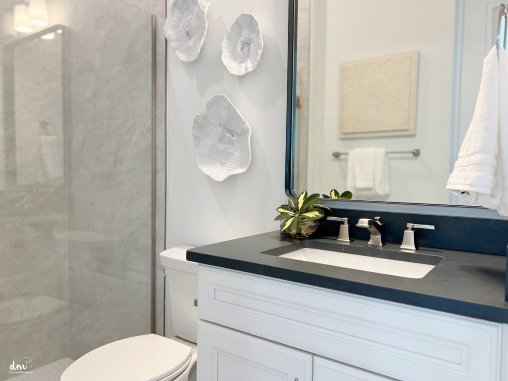 a tidy black and white bathroom