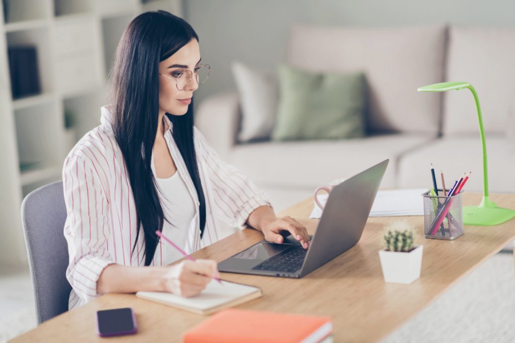 a woman working in a tidy home office