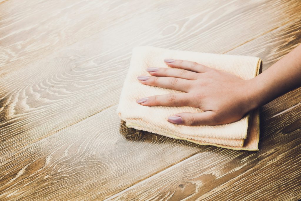 woman cleaning the table cloth