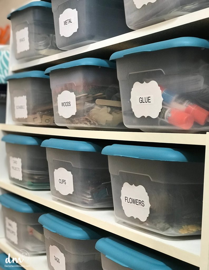 see through storage containers filled with craft supplies