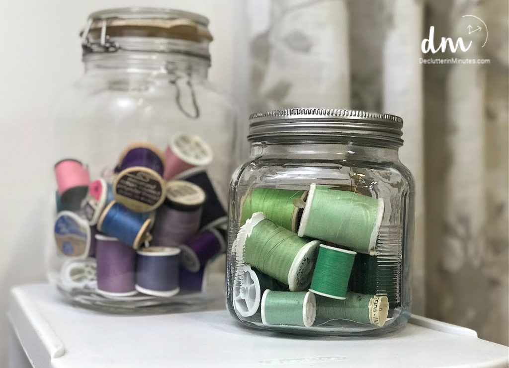 sewing threads in large jars